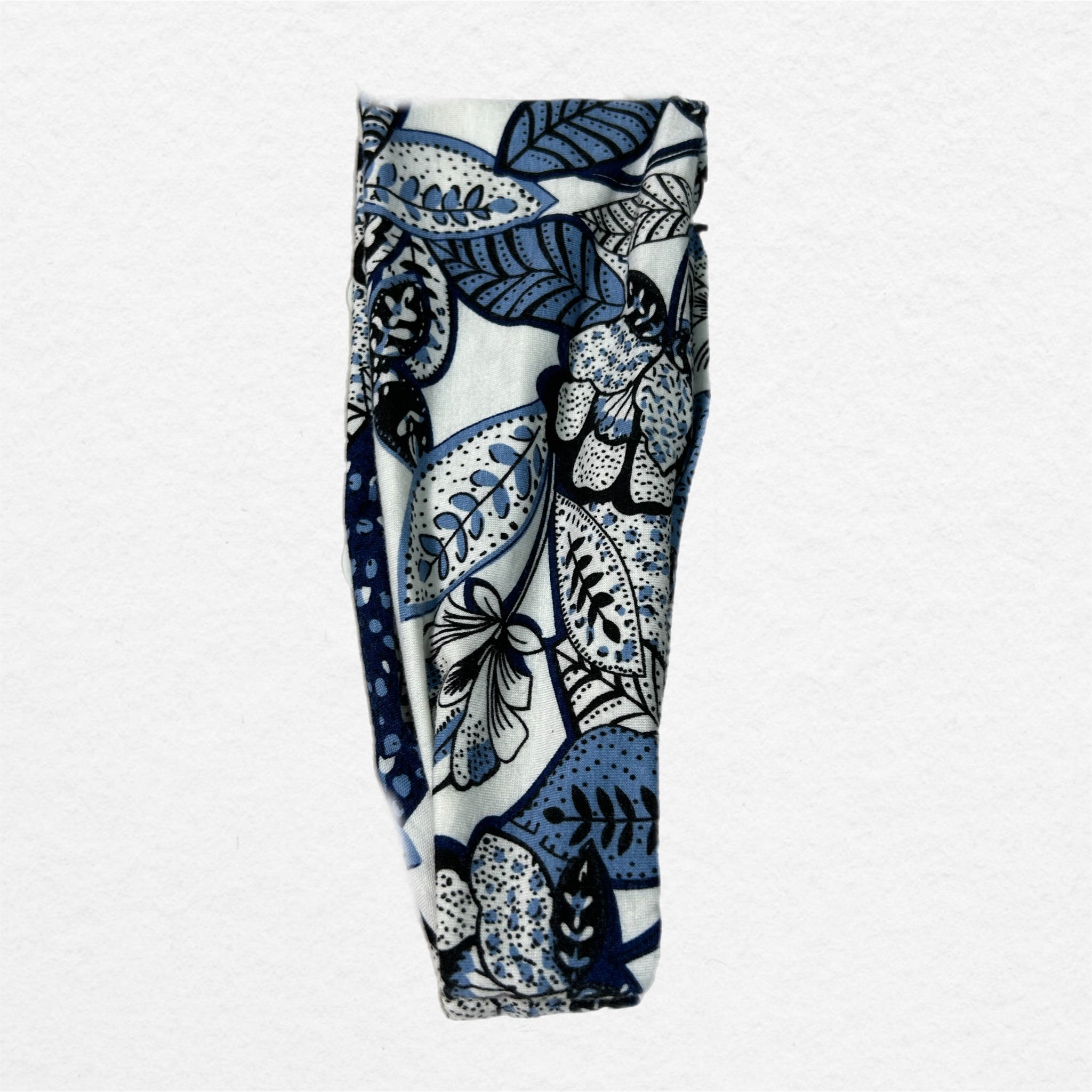 Headband with blue and white floral pattern on a white background
