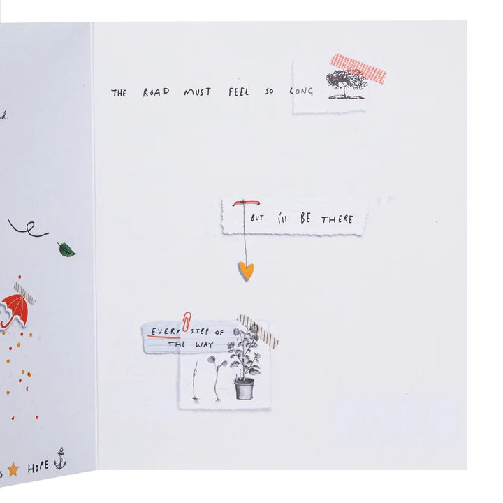 Open book with illustrations and text on a white background