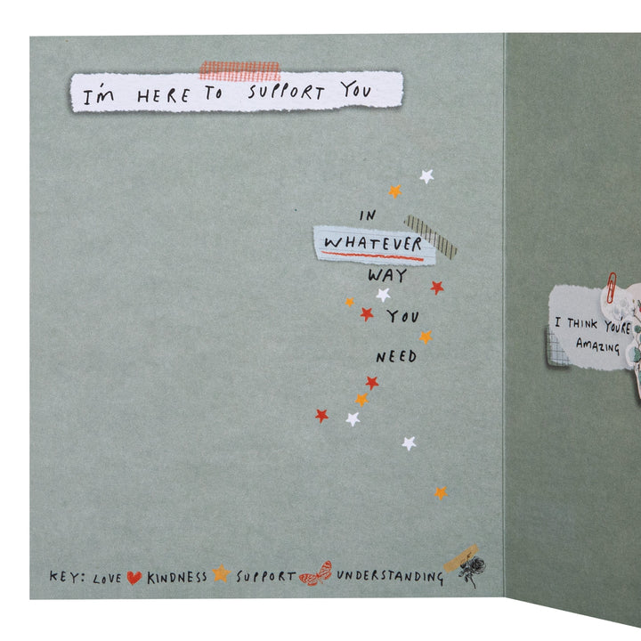 Card with motivational text and symbols on a gray background
