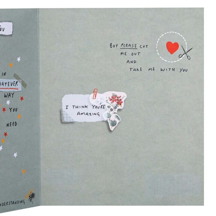 Card with cutout text and decorative elements on a grey background
